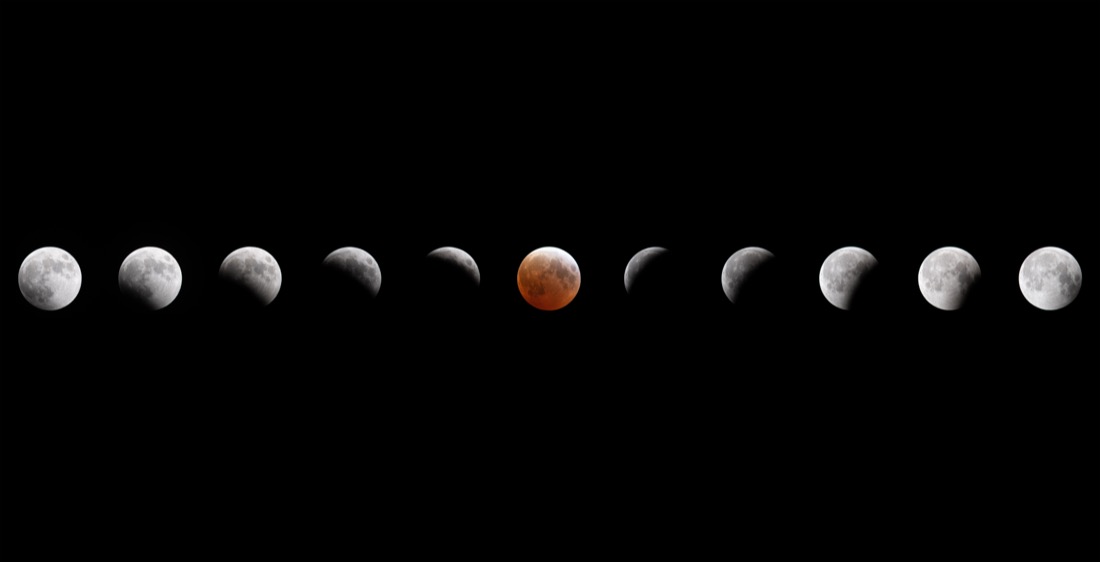 A composite of a total lunar eclipse: the Moon in several phases across the frame, deep coppery red at totality — the “blood moon”.